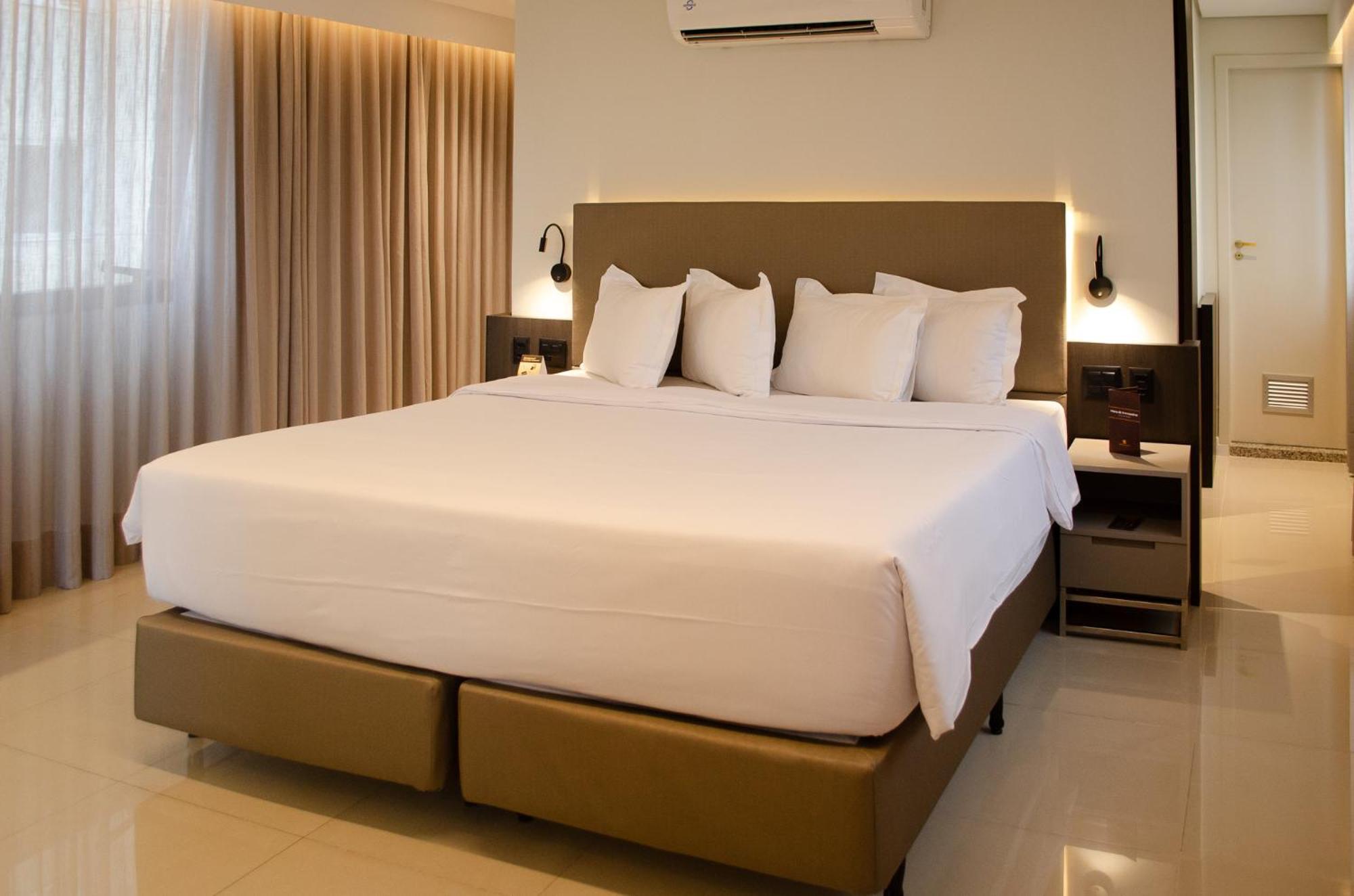Royal Boutique Savassi Hotel Belo Horizonte Extérieur photo A king bed